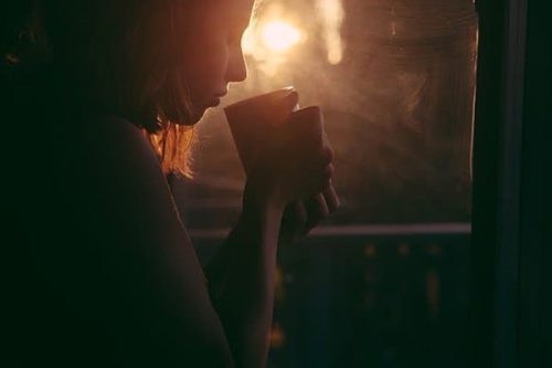 a woman drinking tea before bed