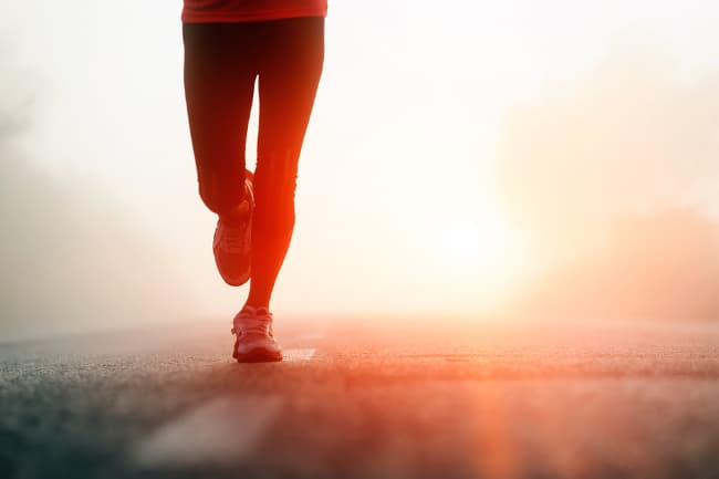 photo of a man running at night