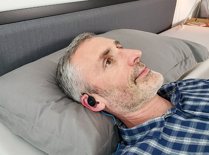 photo of ethan green wearing the dublabs bedphones in bed